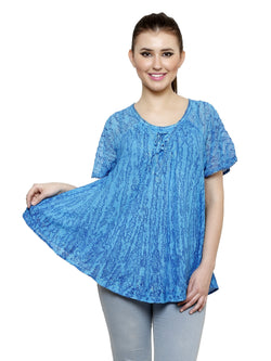 Loose fitting peasant top with stitching along the neckline and hem.